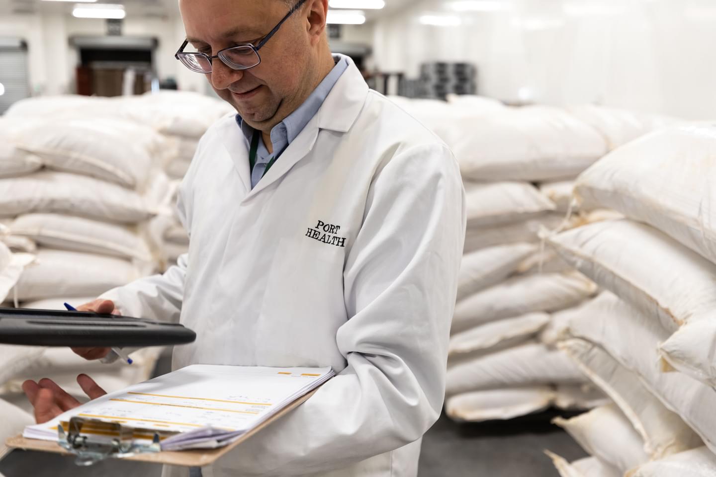 An inspector sampling foodstuffs.